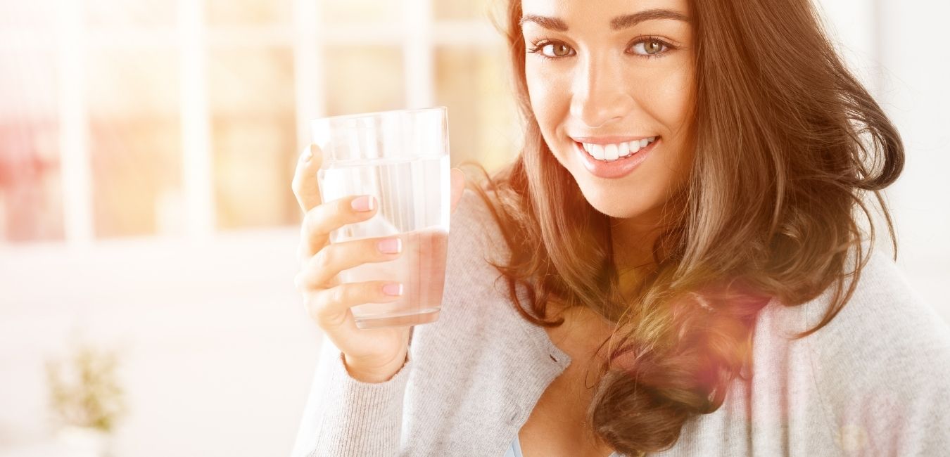 Woman drinking pure filtered water